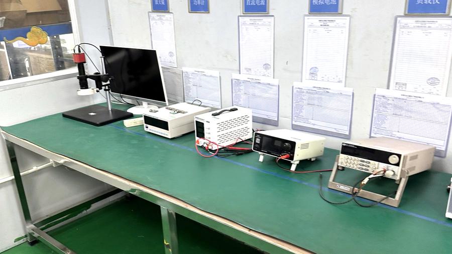 Test bench with power supplies, load meters and signed test records