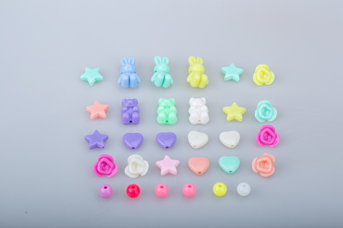Assorted bracelet charms in star, heart, bear, rabbit and flower shapes